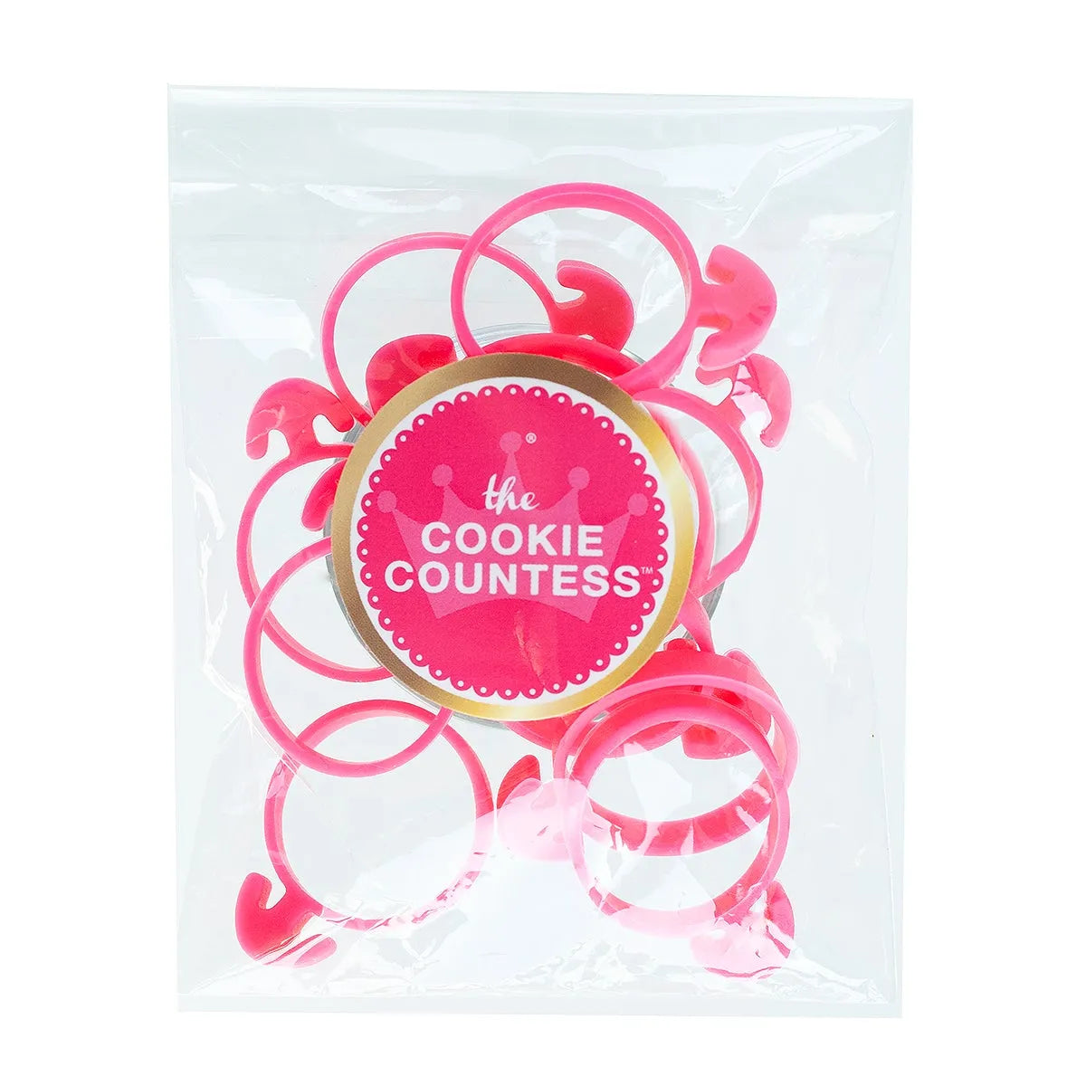 The Cookie Countess Piping Bag Ties verpakking met roze spuitzakclips in een transparant zakje met The Cookie Countess logo sticker, handige herbruikbare clips voor het afsluiten van spuitzakken bij het decoreren van koekjes