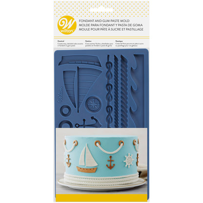 Wilton fondant mal met maritieme figuren zoals anker en stuurwiel