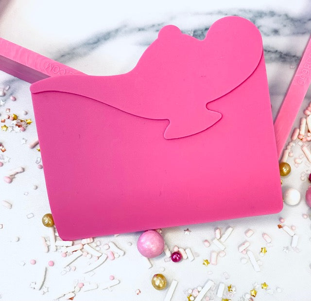 Roze siliconen Icing Genie schraper van de Creative Cookier met genie-figuur, voor het schrapen van royal icing over stencils