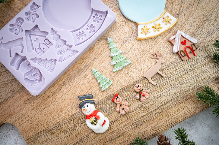 Wintertafereel van fondant gemaakt met de Snowglobe mal van Karen Davies