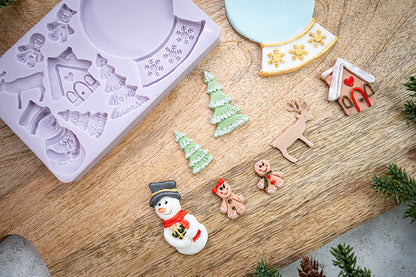 Wintertafereel van fondant gemaakt met de Snowglobe mal van Karen Davies