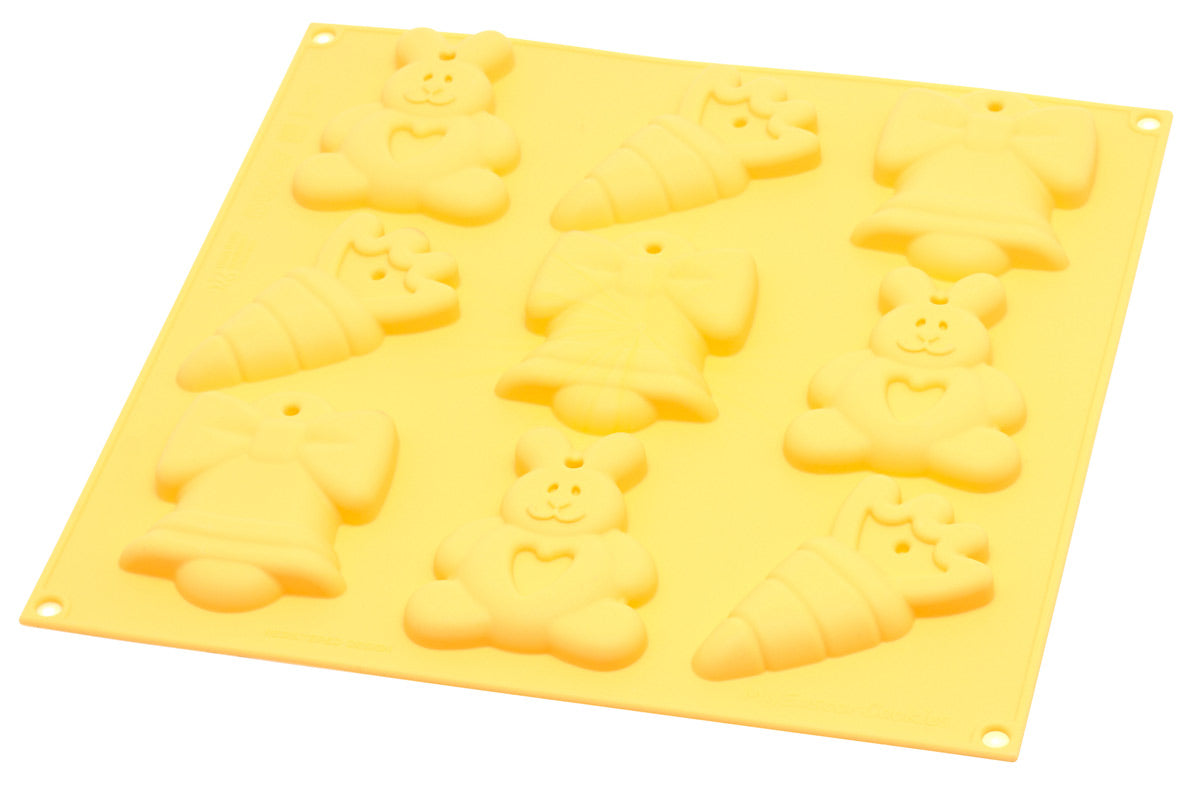 Geeloranje siliconen bakvorm Silikomart My Easter Cookies met 9 paasvormpjes: paashazen met hartje, worteltjes en paasklokken met strik