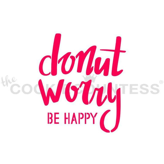 The Cookie Countess Donut Worry Be Happy stencil ontwerp met speelse handlettering tekst in roze, perfect voor het decoreren van donutvormige koekjes met airbrush of royal icing
