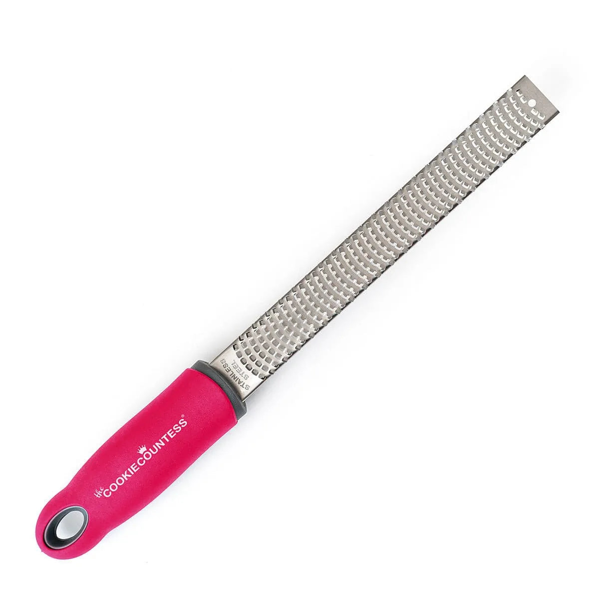 The Cookie Countess Koekjes Rasp met roestvrijstalen raspvlak en roze ergonomisch handvat met The Cookie Countess logo, ideale zester voor het raspen van citroenschil en chocolade over koekjes en taarten
