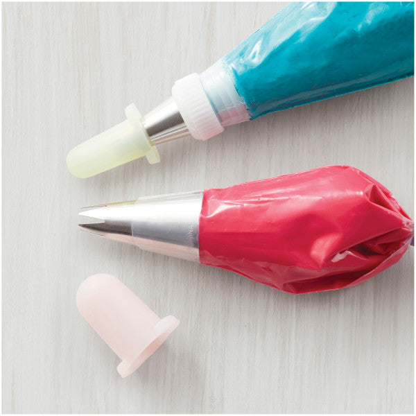 Gevulde spuitzakken met Wilton tip covers over de spuitmondjes