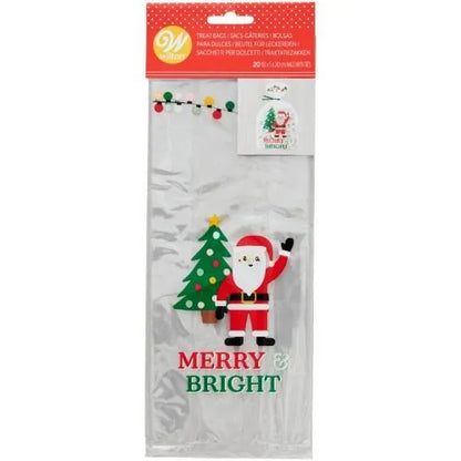 Wilton Zakjes Kerstman Merry & Bright verpakking, set van 20 doorzichtige traktatiezakjes met kerstman en kerstboom design inclusief groene strikjes, ideaal voor het verpakken van kerstkoekjes
