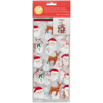 Wilton Zakjes Kerstman Sneeuwpop Rendier verpakking, set van 20 doorzichtige traktatiezakjes met kerstman, sneeuwpop, rendier, zuurstok en peperkoekmannetje design inclusief groene strikjes, ideaal voor het verpakken van kerstkoekjes